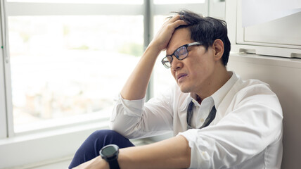 Overload office worker. Alone stressed and sad  asian office worker is sitting beside error copy...