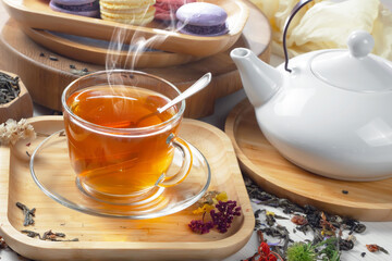 Sweet, hot tea with dessert, on an old background.