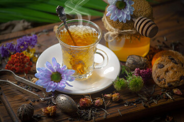 Sweet, hot tea with dessert, on an old background.