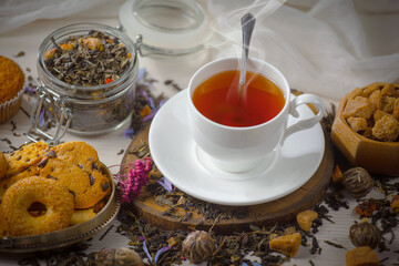 Sweet, hot tea with dessert, on an old background.