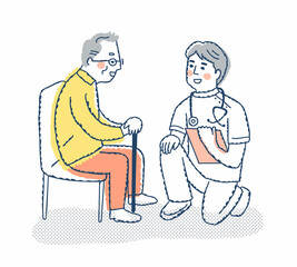 シニア男性としゃがんで話す医療従事者