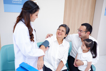 Female doctor measuring patient blood pressure medical concept.