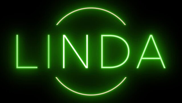Flickering green retro style neon sign glowing against a black background