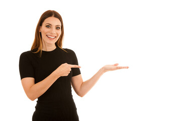 Confidens business woman points into copy space on her left isolated over white background - 578725444