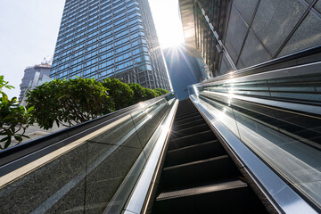 escalator with modern office building - Powered by Adobe