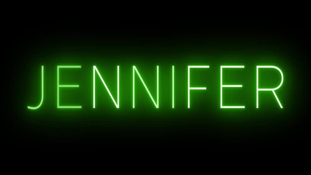 Flickering green retro style neon sign glowing against a black background