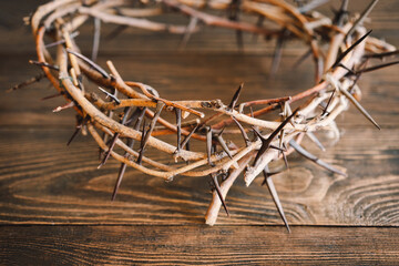 Jesus Crown Thorns and nails and cross on a wood background. Crucifixion Of Jesus Christ. Passion Of Jesus Christ. Concept for faith, spirituality and religion. Easter Day