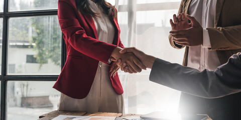 Business people shaking hands, finishing up meeting, business etiquette, congratulation, merger and...