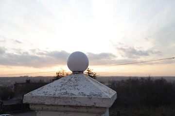 A white stone sphere against sky