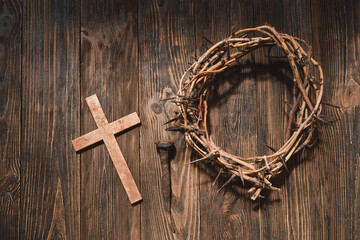 Jesus Crown Thorns and nails and cross on a wood background. Crucifixion Of Jesus Christ. Passion...