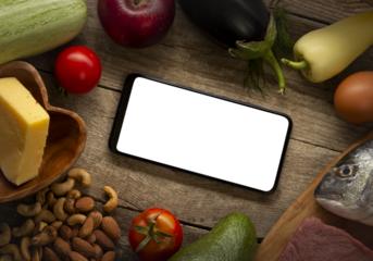 Keto diet inscription and food and smartphone . Healthy products