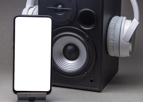 White headphones with smartphone mockup, isolate on grey music online concept.