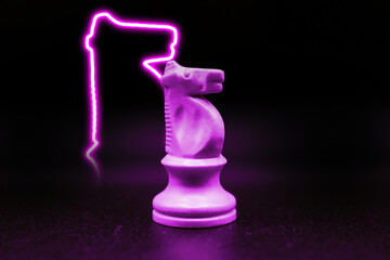 purple pink violet knight with led in the shape of a knight. close up photo with black background....