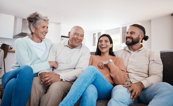 Portrait, Happy Family And Relax On A Sofa, Laughing And Bonding In A Living Room Together. Seniors, Retirement And Weekend Visit By Man And Woman With Mature Parents, Carefree And Fun At Home