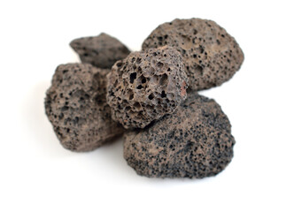 Porous black volcanic rock. Lava stone, pumice stone, or volcanic pumice with distinctive pores