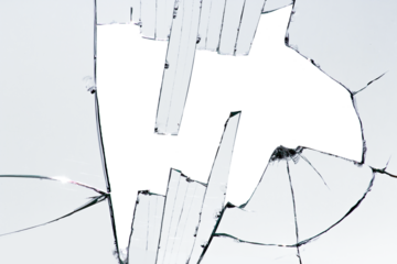 Shards of glass, cracks on a broken window.