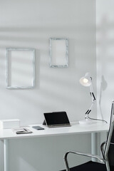 Digital tablet smartphone and planner on desk in minimalist style home office