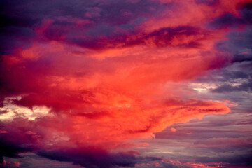 Naklejka na ściany i meble Dramatic sunset sky with clouds. Colorful cloudscape.