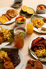 table top view of large Colombian family at breakfast time