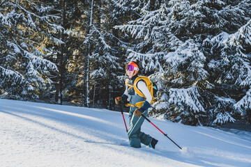 Mountaineer backcountry ski walking ski alpinist in the mountains. Ski touring in alpine landscape...