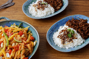 Sweet pork with coconut rice and papaya salad (Khao Man Som Tam). Thai cuisine meal.