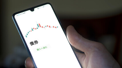 An investor analysing an ETF on a screen. Funds stocks exchange with Japanese text: bond, buy