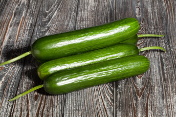 cucumber heap on wood background