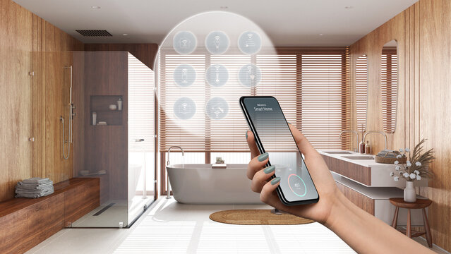 Smart home technology interface on phone app, augmented reality, internet of things, interior design of bathroom with connected objects, woman hand holding remote control device