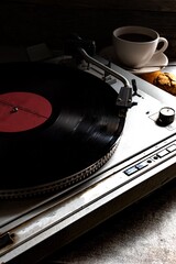 Cup of coffee, vinyl player, and oatmeal cookies. Coffee Jazz.