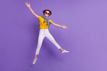 Fototapeta na wymiar Full length photo of overjoyed lady wear trendy outfit rejoice special offer showing empty space isolated on purple color background
