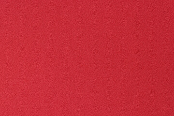 Plain unicolorous red textile as background.