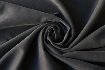 Shaped dark gray fabric background or design element.
