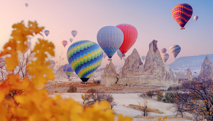 Landscape sunrise in Cappadocia with set colorful hot air balloon fly in sky with sun light. Concept banner tourist travel Goreme Turkey - obrazy, fototapety, plakaty