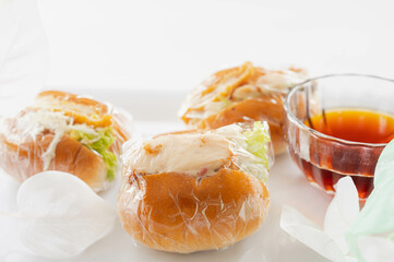 包んだコロッケパンとコーヒー