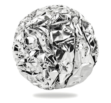 Foil aluminum crumpled ball on white background