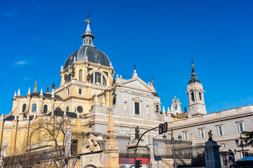 Fototapeta na wymiar Cupula and annexed constructions of the Almudena Cathedral on its back in the city of Madrid, Spain.