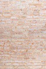 Background texture of old vintage dirty brick wall with white stains. Full frame