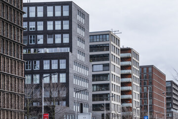 View of high-density residential and business area on the banks of the IJ River at the Oostelijke Handelskade (Eastern Docklands). Amsterdam, The Netherlands. 