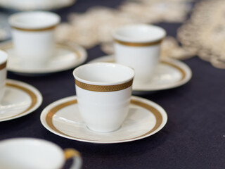 Empty white ceramic coffee cup in a open market