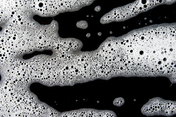 Abstract background white soapy foam texture. Shampoo foam with bubbles