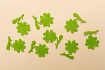 Felt clover on color background, top view. St. Patricks day concept