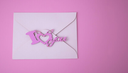 White envelope for Valentine's Day on a pink background. The concept of a love message for March 8, Mother's Day, Father's Day, Family Day