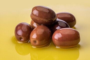Olives on Extra virgin olive oil in close up