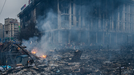 Burned building and barricades at the Maidan square in Kyiv, Ukraine during anti government...