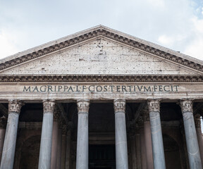 Ancient Pantheon building against cloudy sky in Rome