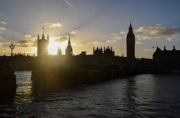 Silhouette of the Houses of Parliament, Westminster Bridge and Big Ben at sunset in London, UK