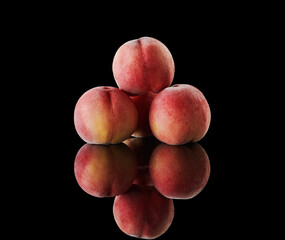 Fresh peaches on dark background
