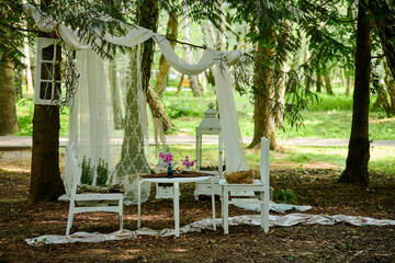 Art room with white furniture and curtains in forest for wedding photo shots, forest art decoration...