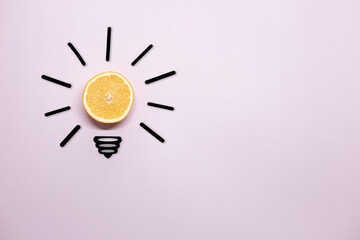 Creative thinking ideas and innovation concept. A ball of orange with a light bulb symbol on a...