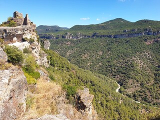 Dry Siurana reservoir during the summer, view of the medieval village of Siurana with the river almost dry, drought in Catalonia, Spain